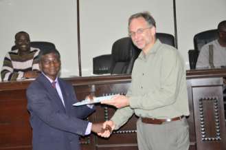 RMU Nautical Sciences department head Stephen Yeboa receives certificate from Brian Arbic